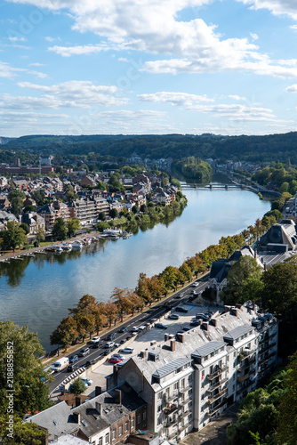 Bild auf Leinwand River winds through picturesque town under bright sky namur belgium