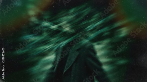 Abstract green gradient with motion blur, grainy brushed texture and dark green light leaks on black, retro film overlay for cinematic effects