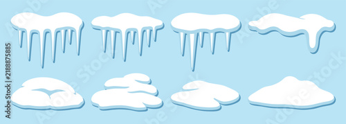 Set of white snow caps and icicles for winter holiday design elements on a light blue background