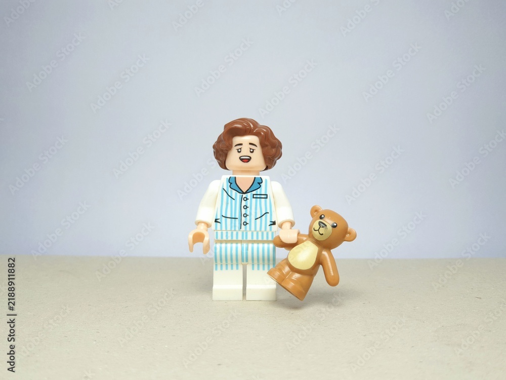 Fototapeta premium Indonesia - November 24, 2023 : Mini toy figure of lego at table with blurred background. Miniature photography concept design.