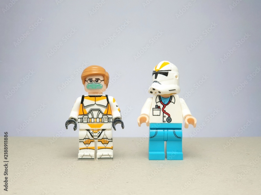 Obraz premium Indonesia - November 24, 2023 : Mini toy figure of lego at table with blurred background. Miniature photography concept design.