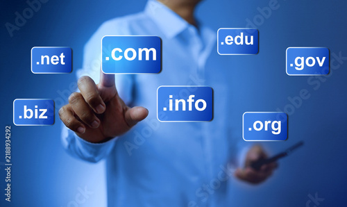 Foto Domain name concept with a man touch on  dot com to be a website domain in business webpage globally recognized