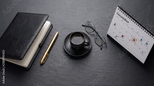 Stylish Desktop Flat Lay with Black Notebook, Gold Pen, and Sale Planner