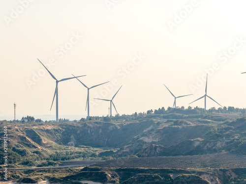 Принти на полотні Wind turbines standing on the hillside generating clean energy
