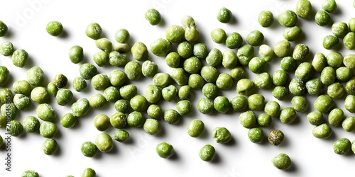 Fresh green peas scattered across a clean white background