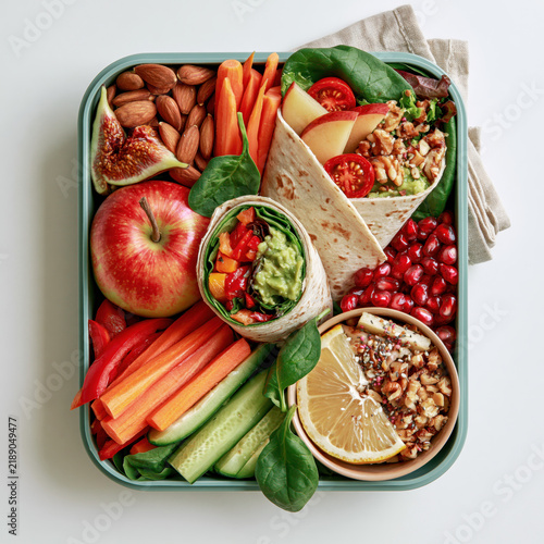 Plant based lunch healthy food school lunch lunch box vegetable wrap fresh fruit nuts vegan meal colorful snack balanced diet Plant based lunch healthy food school lunch lunch box vegetable wrap