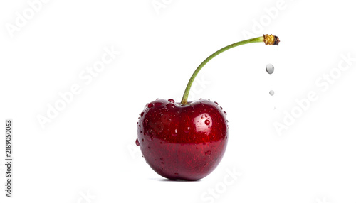 Fresh Red Cherries in Clear Water Glass Isolated on White Background for Healthy Fruit Dessert and Natural Freshness