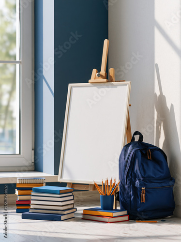 School classroom education blank sign template easel backpack book pencil first day of school blank sign wooden easel bright classroom corner with backpack books and pencils ready for learning