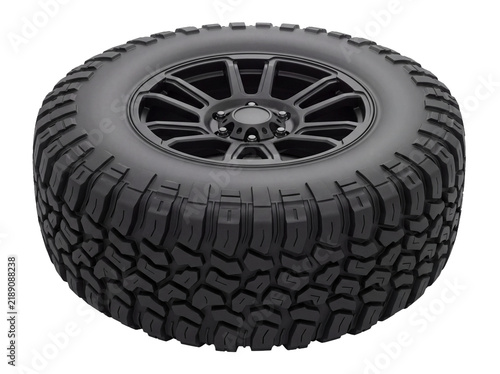 Black off-road vehicle tire with alloy rim isolated transparent background
