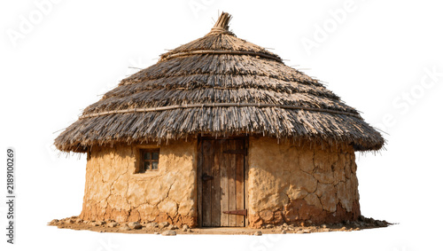 Bild auf Leinwand Traditional thatched roof mud hut with wooden door and small window, isolated on