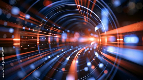 Abstract futuristic tunnel with dynamic blue and orange light trails, glowing particles, and circular motion effects, creating a high-speed digital technology background.
