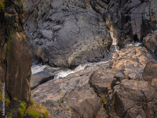  Fast Water Runs In Crack Between Rocks