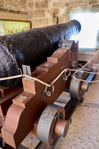 A Old pirate ship cannon ready to fire. High quality photo