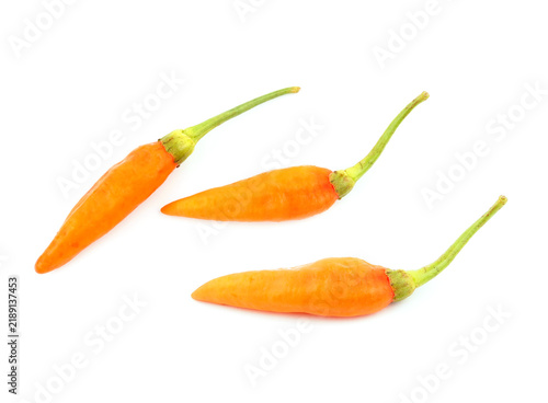 Fresh orange bird's eye chili peppers isolated on white background.