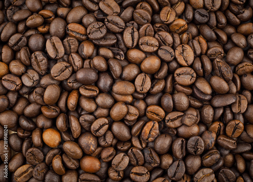 Roasted coffee beans texture background full frame top view.