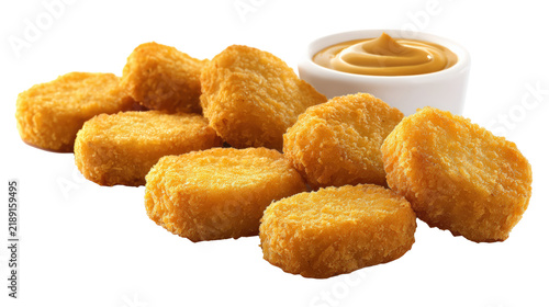 Golden chicken nuggets served with mustard dipping sauce