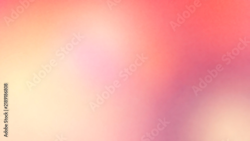 Abstract soft blurred background with a gradient of warm colors including shades of pink, orange, and yellow