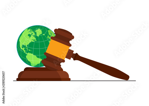 wooden gavel next to a globe symbolizing international law and justice
