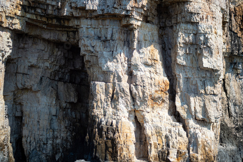 Foto A close-up view shows rugged limestone cliffs along the sea coast in Corfu, Greece