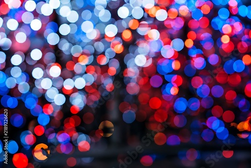 christmas lights background Abstract red blue and white blurred bokeh lights background for festive celebration