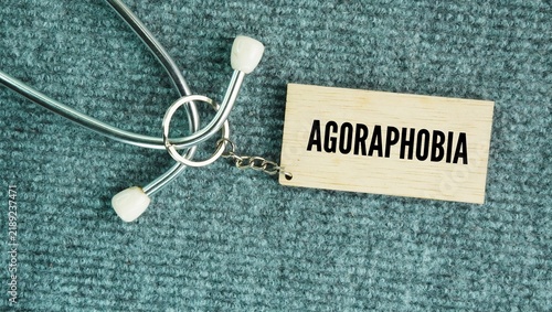 Bild auf Leinwand Stethoscope and wooden tag with the word Agoraphobia is an anxiety disorder char