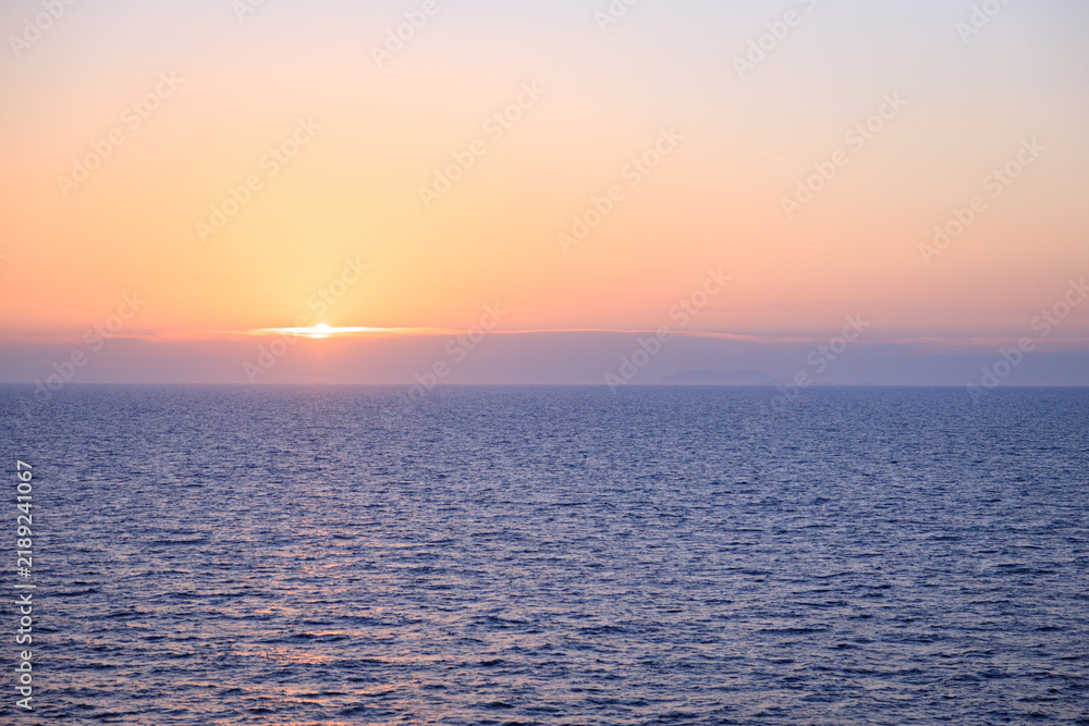 Fototapeta premium Sunset over the Mediterranean Sea with Golden Reflection