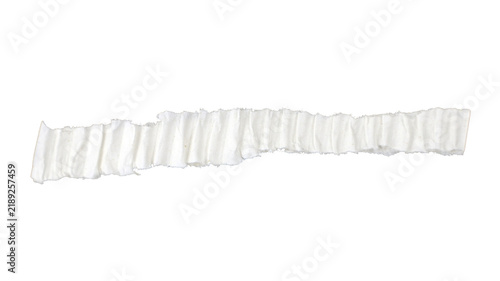 Torn and ragged strip of corrugated paper, isolated on a transparent background.