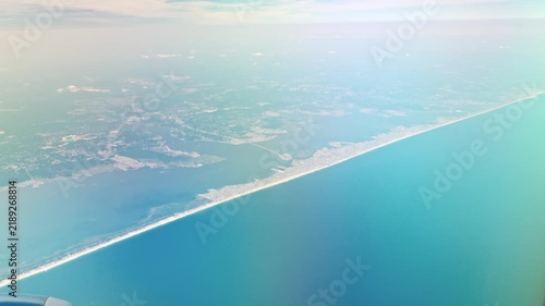 Beautiful view of New York coastline and Atlantic Ocean from airplane approaching city.