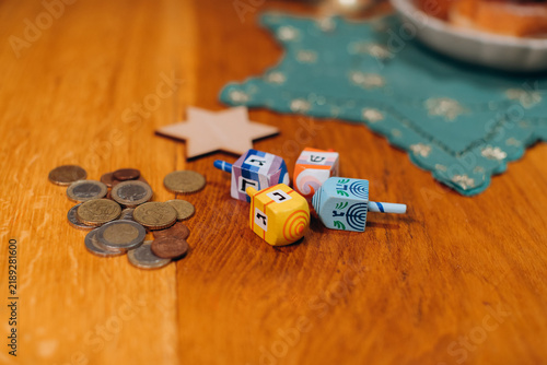 Obraz na plátně Hanukkah celebration with dreidels, gelt, and jewish symbols