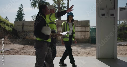 Construction, team or clipboard for site inspection, compliance audit or renovation progress. People, architect or subcontractor with building visit for remodeling quality, punch list or phase check