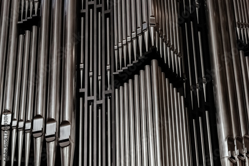 Close view of organ pipes arranged in a detailed pattern during a music performance