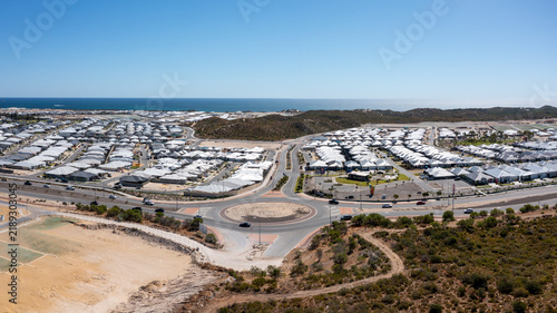 Aerial view of roundabout and new Propertys, homes and Land in suburb Perth, Western Australia