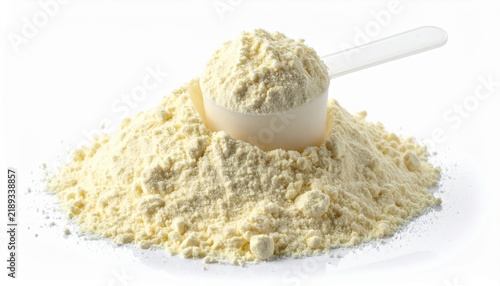 Heap of vanilla protein powder with measuring scoop, isolated on white background