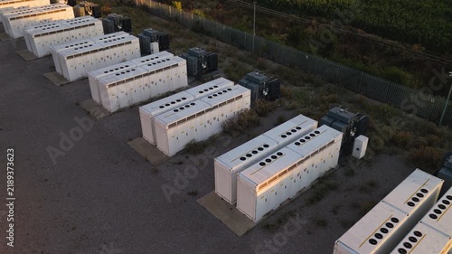 BESS Arrays at an Industrial Site Under Late Afternoon Sun
