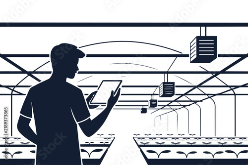 Farmer using digital tablet to monitor automated growth in a large commercial indoor greenhouse facility