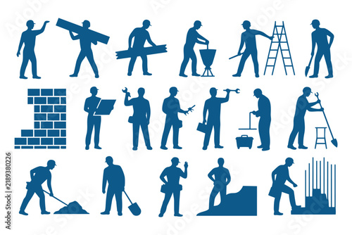 Group of construction workers performing various manual labor tasks using tools and building equipment at site