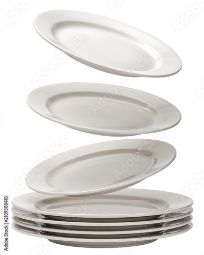 Collection of white round plates stacked against a plain white background with dining plates porcelain dishes ceramic dishes kitchen equipment food presentation restaurant supplies home dining