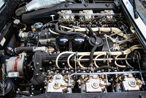 Bild auf Leinwand Inline engine with carburettors detail