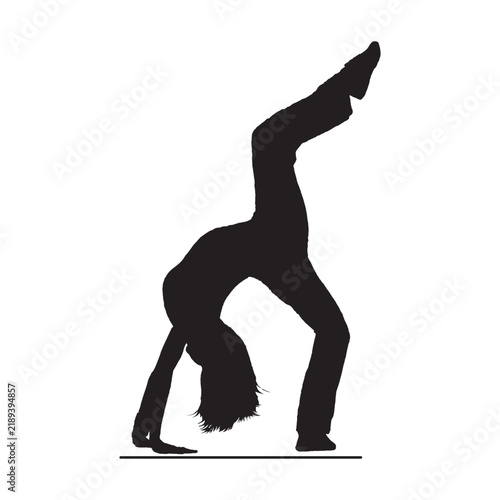 Silhouette of female acrobat or gymnast performing backbend acrobatic stunt