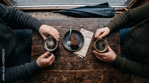 Two people enjoying hot coffee