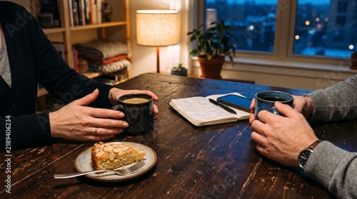 Two people having coffee conversation