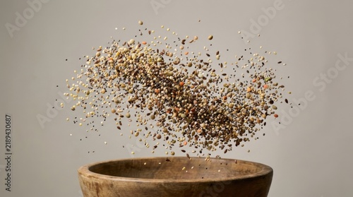 Cereal Grains and Seeds Flying in Dynamic Cloud Above Wooden Bowl