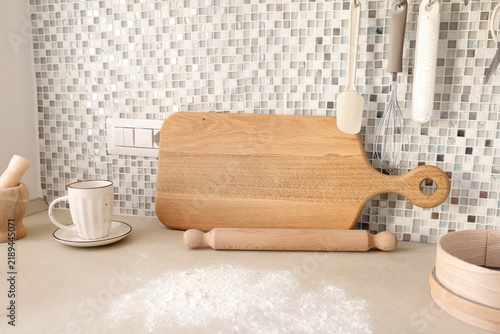 Bild auf Leinwand Flour spilled on beige kitchen counter for baking preparation scene