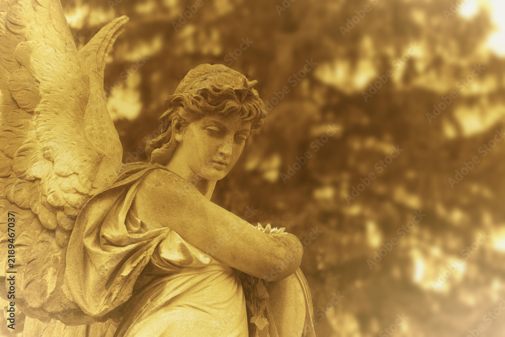 Fototapeta premium Angel of Death statue as a symbol of grief, mourning and remembrance of a deceased person. Copy space for text or design.