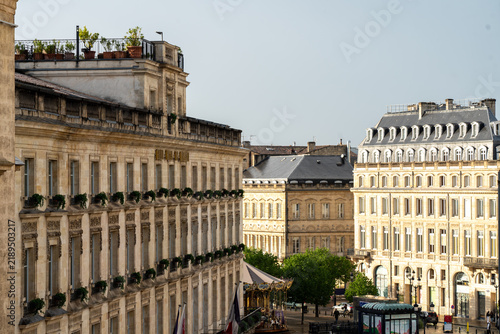 Historic neoclassical hotel architecture at Place de la Comedie in Bordeaux, France. Luxury European travel destination, historic urban heritage scenery, commercial real estate development.