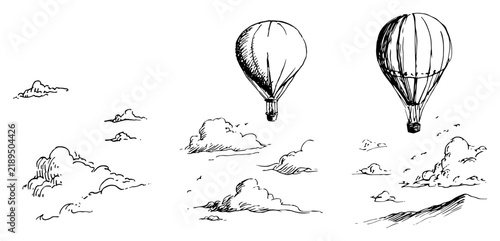Hot air balloons flying above clouds and mountains in vintage ink sketch style