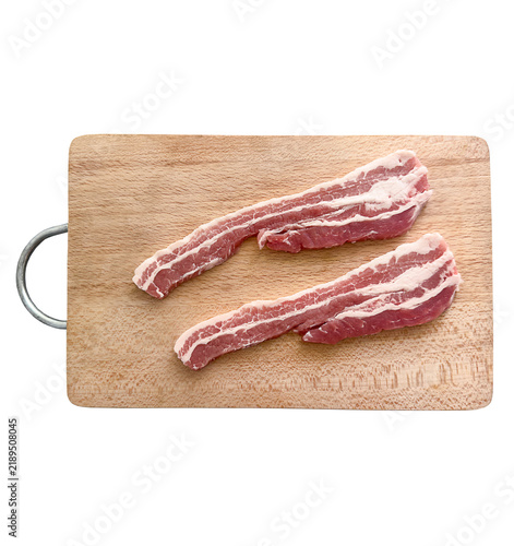 Fotografía Raw pork belly strips show meat fat protein calories on a wooden cutting board, ready for cooking in the kitchen