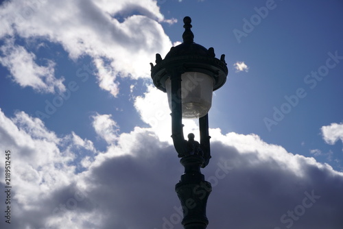 lamp post against blue sky