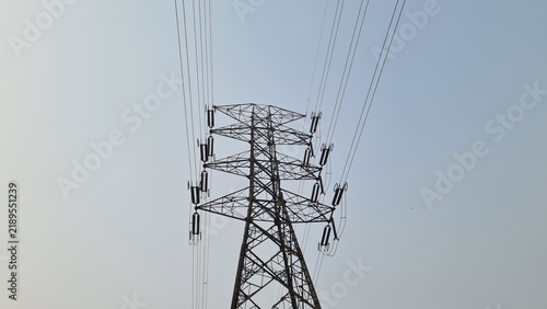 Konstfotografi High Voltage Electricity Transmission Tower Pylon with Power Lines Against a Cle