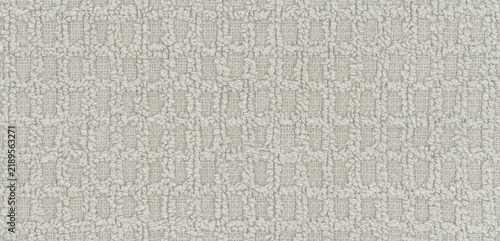 Cuadro en lienzo Square recesses interrupt the raised loops of gray terry fabric, a checked texti